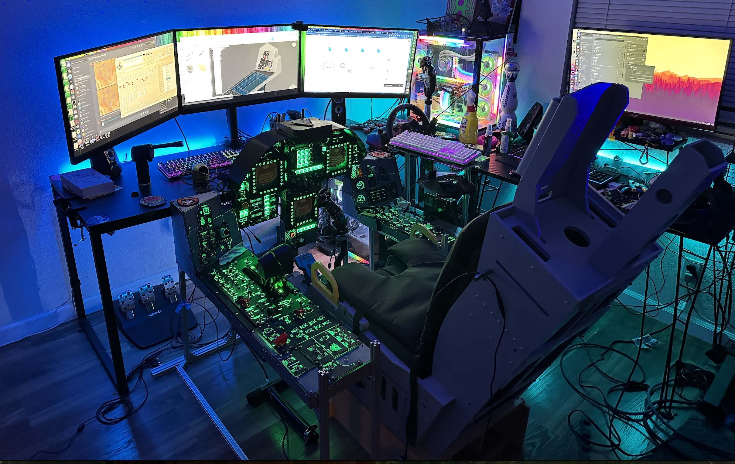 Custom-built F-18 VR cockpit with green-lit control panels and professional flight simulator setup